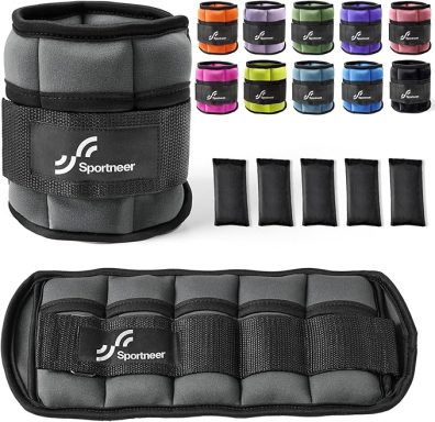 Gray ankle weights with black straps and colorful weights in the background.